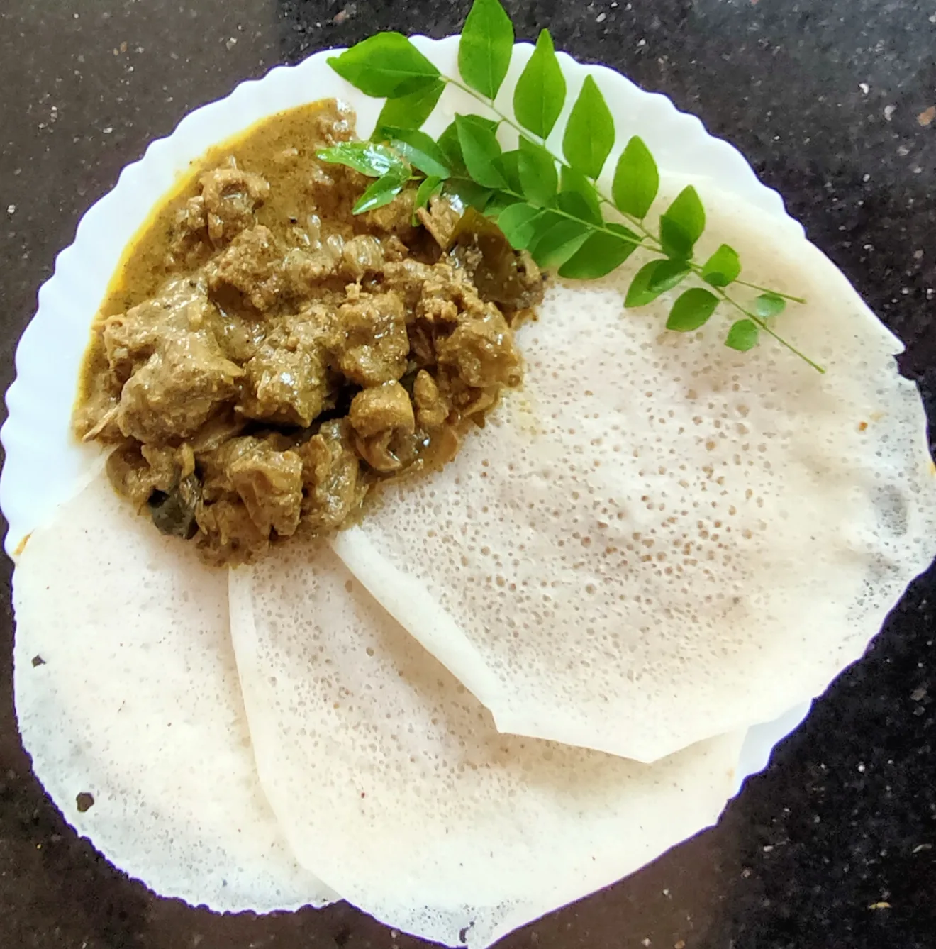 Palappam with duck curry, a meat pairing for the same hopper.