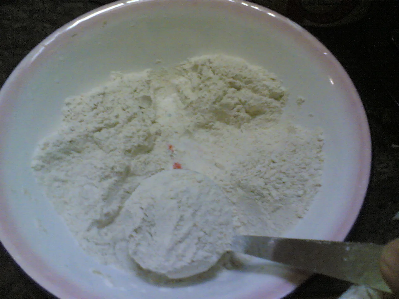 Atta — whole-wheat flour measured for the dough.