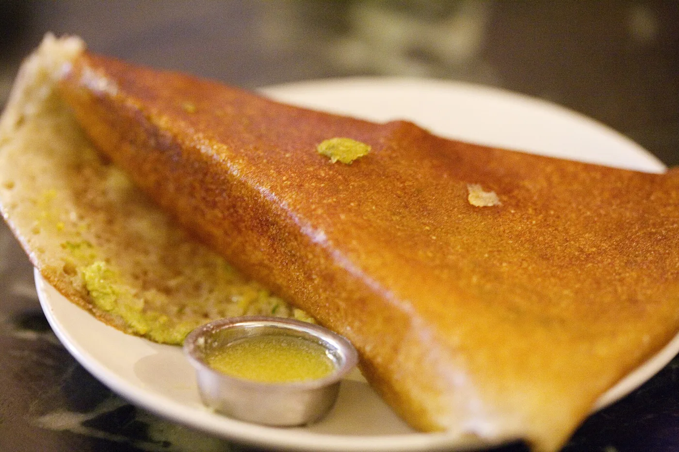 Roast dosa served with ghee.