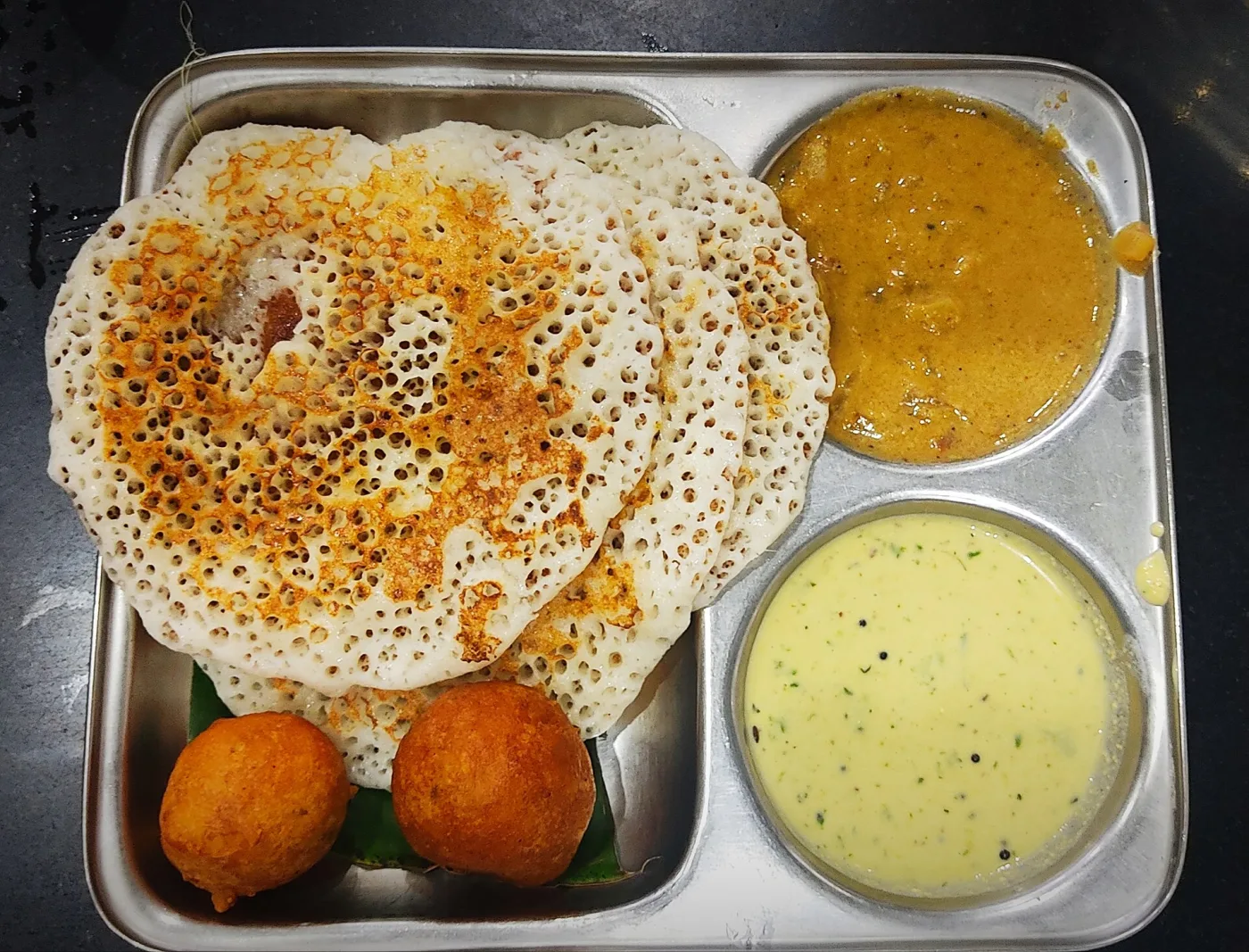 Set dosa with sambar, coconut chutney, and bonda.
