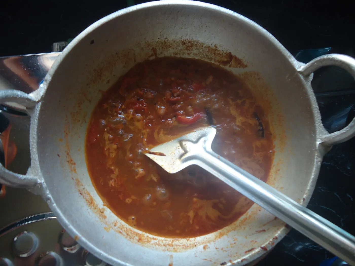 Kadala curry simmering in a cheenachatti.