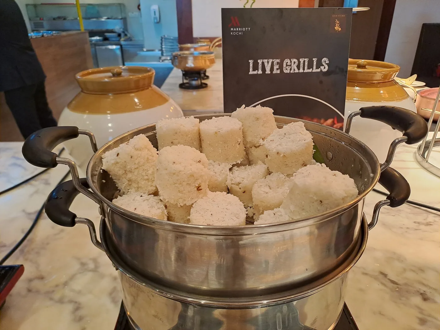 Cylinders of puttu (പുട്ട്) in a hotel steamer.